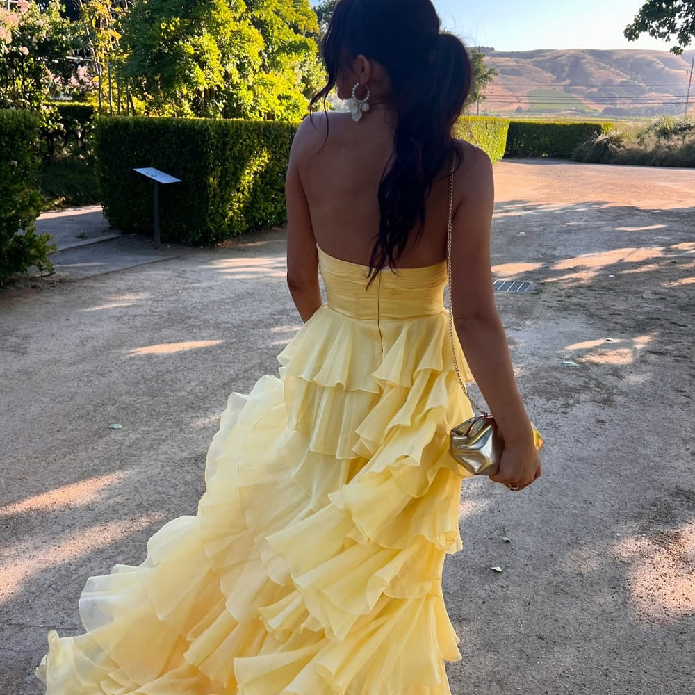 
                      
                        Strapless Yellow Tiered Long Dress with a Rosette
                      
                    