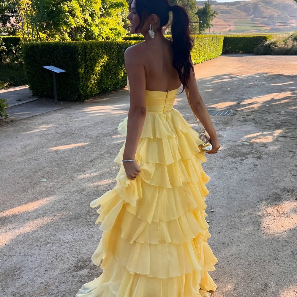 
                      
                        Strapless Yellow Tiered Long Dress with a Rosette
                      
                    